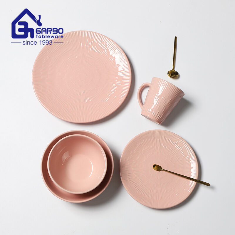 Elegant Dining Experience: Pink Glazed Stoneware Dinner Set with Embossed Designs from Garbo International