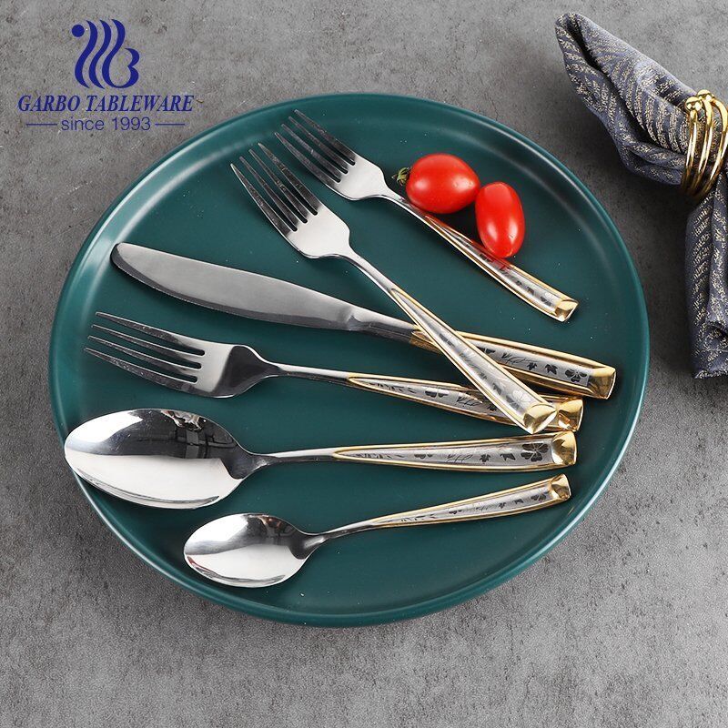 Luxury stainless steel  fork with golden decor and engraved pattern for wedding services